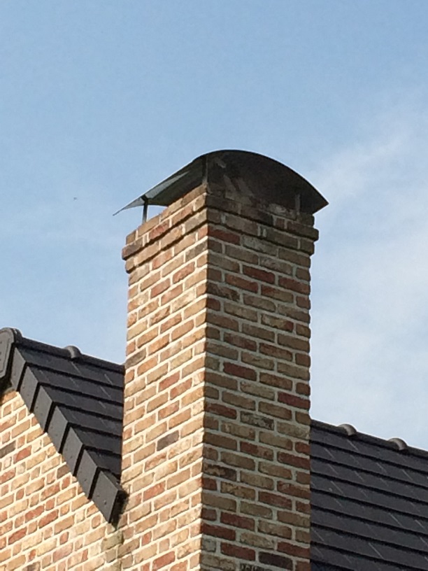 Un chapeau de cheminée en béton sur mesure